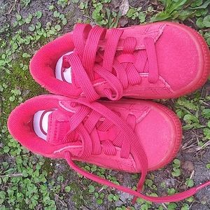 Puma red sneakers for babies.